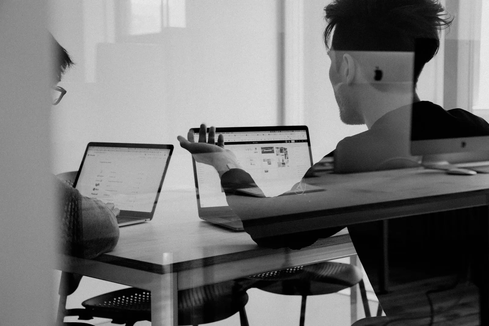 IT specialist working across multiple screens